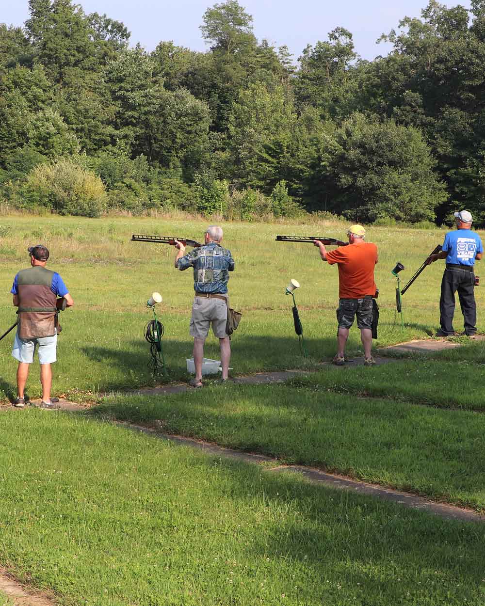 Four men shooting skeet at the Norry Gun Club | Northumberland-Point Township Sportsmen’s Association